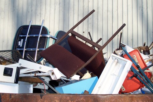 Cluttered garden before clearance in Cricklewood